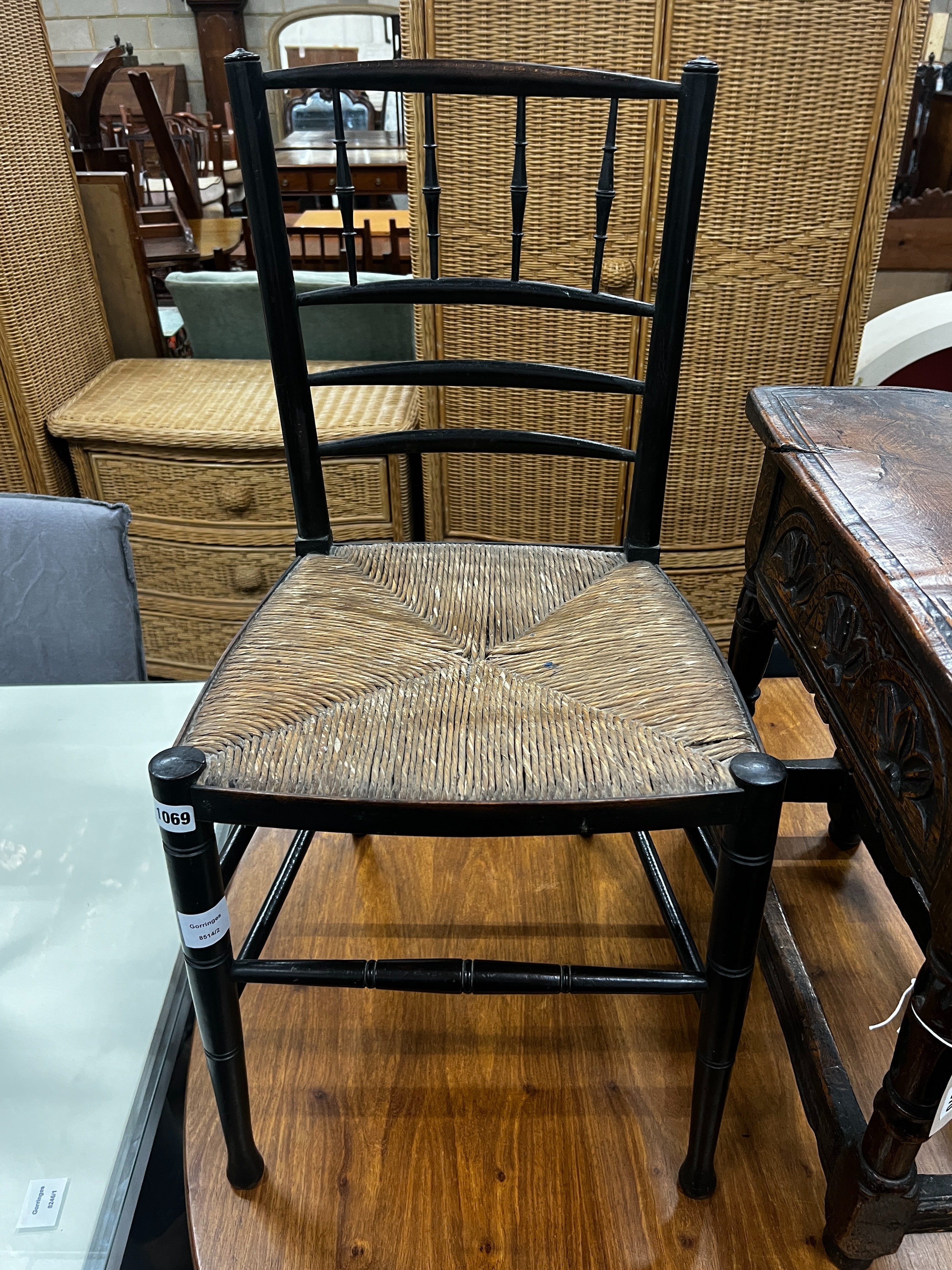 A 19th century ebonised beech rush seat Sussex style chair, width 41cm, height 83cm